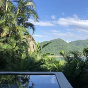 A breathtaking infinity pool and ocean view setting for an intimacy and connection couples retreat, designed to strengthen relationships.