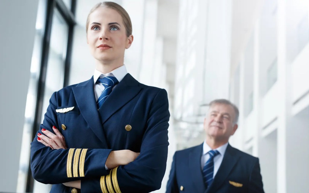 Flying-in-therapy Two pilots in a heroic post, representing how your therapist is your co-pilot not your flight instructor