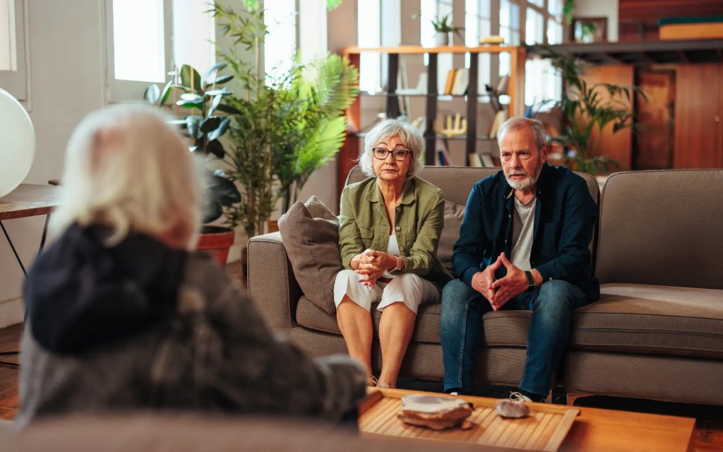 Couples-therapist-in-LA An older couple looking at their couples therapist with a serious look on their face