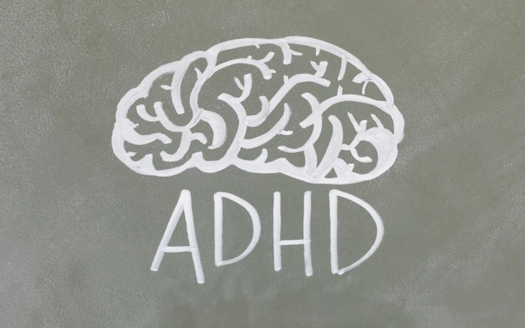 ADHD-Therapy A drawing of a brain on a chalkboard with the acronym ADHD underneath, representing ADHD therapy offered by GGPA in Los Angeles