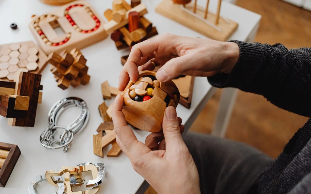 An adult with ADHD playing with a sensory stimulation fidget toy