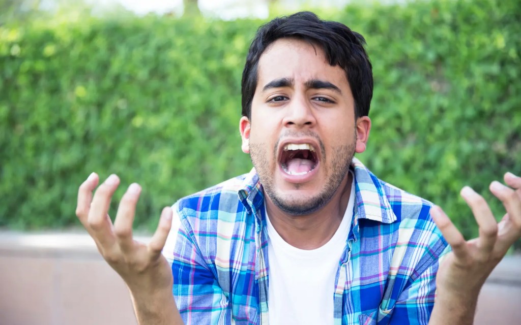 An overwhelmed man with ADHD, representing mood swings in ADHD burnout cases